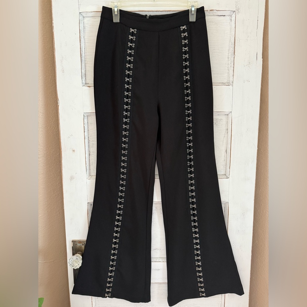 NBD Black Flare leg pants with silver hook & eye accents. Size Medium